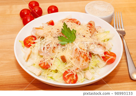 Caesar salad with chicken and crackers Caesar salad with chicken and crackers 98993133