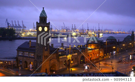 Famous St Pauli Landungsbruecken at the port of Hamburg - amazing evening view Famous St Pauli Landungsbruecken at the port of Hamburg - amazing evening view 98994313