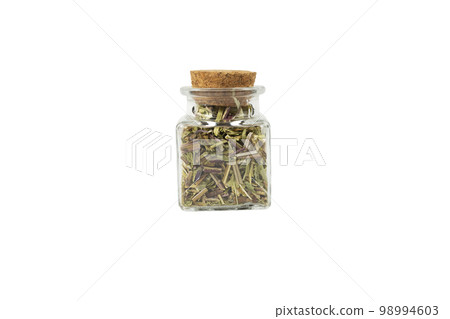 Catnip herb in latin - Nepeta cataria in a glass jar isolated on white background. Medicinal herb. 98994603