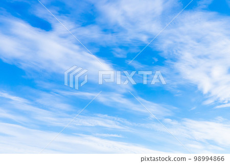 Blue sky with white clouds on a sunny day. Natural background 98994866