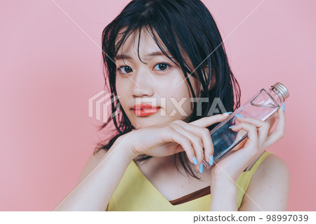 Photo of a young woman wearing cheap clothes Photo of a young woman wearing cheap clothes 98997039