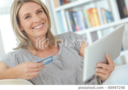 Online shopping portrait, tablet or happy woman with credit card for digital bank payment, fintech or finance sale. Website store, e commerce gift card or customer search for ecommerce retail product Online shopping portrait, tablet or happy woman with credit card for digital bank payment, fintech or finance sale. Website store, e commerce gift card or customer search for ecommerce retail product 98997298