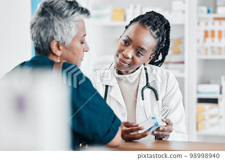 Pills, pharmacy or old woman consulting with a pharmacist for retail healthcare treatment information. Questions, trust or black woman helping a senior woman shopping for medicine or medical drugs Pills, pharmacy or old woman consulting with a pharmacist for retail healthcare treatment information. Questions, trust or black woman helping a senior woman shopping for medicine or medical drugs 98998940