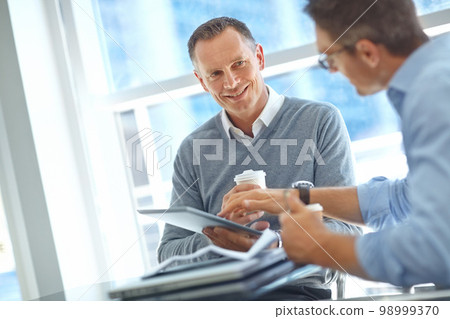 Happy corporate or business people in airport for global invest strategy, finance growth or financial review. Travel, smile or manager in lobby for social media, data analysis or economy research 98999370