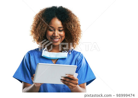 Doctor, black woman and tablet for typing in studio with smile, focus and web communication by white background. Isolated nurse, touchscreen tech or reading on social media app, medical news or chat Doctor, black woman and tablet for typing in studio with smile, focus and web communication by white background. Isolated nurse, touchscreen tech or reading on social media app, medical news or chat 98999474
