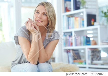 Woman, thinking and relax on sofa in home for thoughtful mindfulness, positive mindset and calm day dreaming. Female, relaxing and peace, pensive and planning vision or lifestyle wellness on couch Woman, thinking and relax on sofa in home for thoughtful mindfulness, positive mindset and calm day dreaming. Female, relaxing and peace, pensive and planning vision or lifestyle wellness on couch 98999820