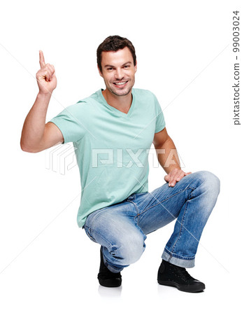 Portrait, mock up and pointing with a man in studio isolated on a white background for marketing or advertising. Product, branding and mockup with a handsome young male posing to promote a brand Portrait, mock up and pointing with a man in studio isolated on a white background for marketing or advertising. Product, branding and mockup with a handsome young male posing to promote a brand 99003024