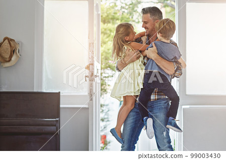 Family, father and children with hug and fun, love and hello at door with happiness in family home. Happy people, parent and kids with care, lifestyle and wellness with bond and excited together 99003430