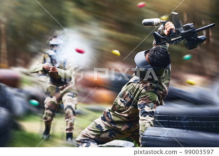 Paintball, sport and action with gun for shooting, speed and military battlefield with soldier, war and fitness outdoor. People together in camouflage, mask with weapon and game, power and lifestyle 99003597