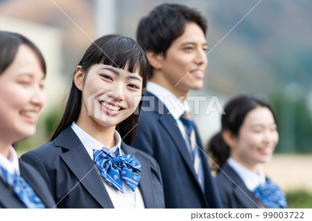 High school girls and boys lined up in the schoolyard 99003722
