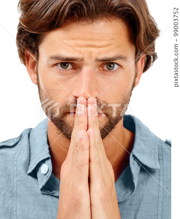 Portrait, man or anxiety and praying hands on studio background in mental health, stress burnout or nervous. Zoom, face or worried model and hope, prayer or wish gesture for good news, luck or change 99003752