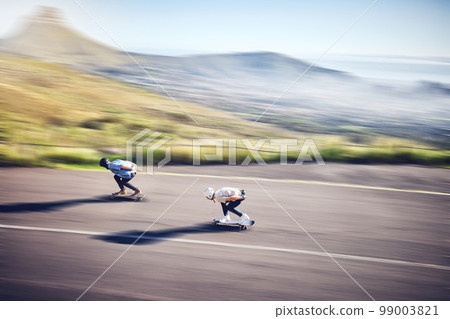 Skateboard, fast and road with people training, competition or danger, risk and adventure sports from above. Speed, motion and moving skater team on a street for youth energy, performance and action 99003821