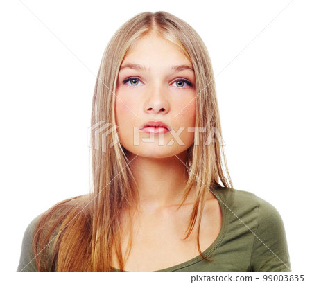 Beautiful, portrait and teenage model in studio with green eyes doing serious, confident and natural pose. Beauty, headshot and face of a young girl model posing while isolated by white background. Beautiful, portrait and teenage model in studio with green eyes doing serious, confident and natural pose. Beauty, headshot and face of a young girl model posing while isolated by white background. 99003835