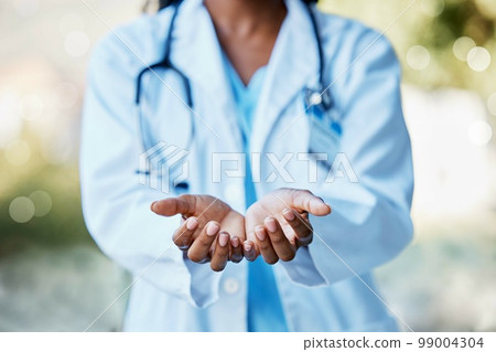 Healthcare, doctor and hands open to help in giving health care, support and volunteer in hospital in Africa. Black woman medical worker, stethoscope and helping hand in trust working charity clinic. 99004304