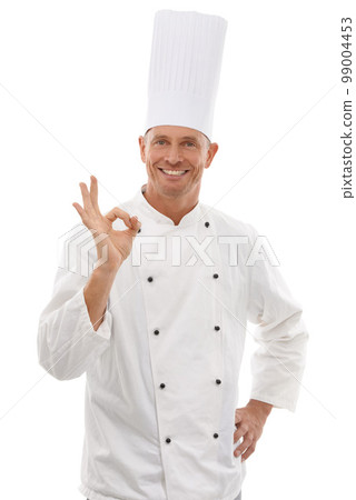 Portrait of chef, man with ok hand gesture and confident smile, cafe owner isolated on white background. Happy executive cook, uniform tasty emoji for restaurant discount deal or promotion in studio. 99004453