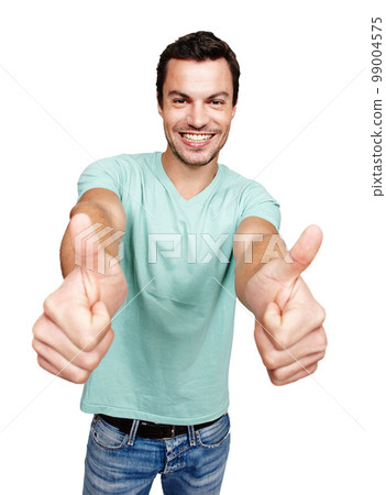 Portrait, thumbs up and motivation with a man in studio isolated on a white background showing an emoji as a winner. Thank you, goal or target with an excited man giving a positive hand sign 99004575