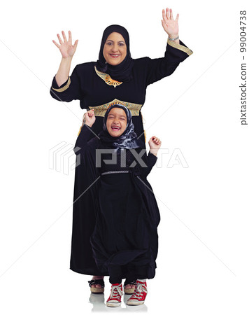 Portrait, children or muslim with a mother and daughter in studio isolated on a white background together as a family. Eid, love or islam with a woman and girl bonding on blank space for religion 99004738