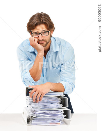 Burnout, stress and businessman with stack of paperwork on desk for deadline, corporate project and report. Ideas, vision and tired employee thinking with pile of files, review papers and documents Burnout, stress and businessman with stack of paperwork on desk for deadline, corporate project and report. Ideas, vision and tired employee thinking with pile of files, review papers and documents 99005068
