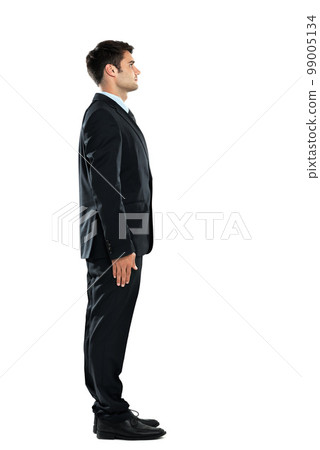 Serious, successful and young businessman standing isolated on a white background in a studio. Side profile, confident and office worker in a suit for work on a studio background with mockup space 99005134