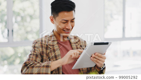 Tablet, research and creative with an asian man designer thinking about an idea while working on a design. Internet, innovation and search with a male employee at work in his marketing office Tablet, research and creative with an asian man designer thinking about an idea while working on a design. Internet, innovation and search with a male employee at work in his marketing office 99005292