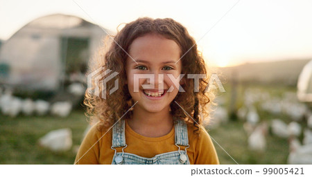 Chicken, smile and girl on a farm learning about agriculture in the countryside of Argentina. Happy, young and sustainable child with an animal, bird or rooster on a field in nature for farming 99005421