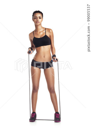 Fitness, resistance band and portrait of a woman in a studio for a wellness, health and strength workout. Sports, training and slim female model with sport equipment isolated by a white background. Fitness, resistance band and portrait of a woman in a studio for a wellness, health and strength workout. Sports, training and slim female model with sport equipment isolated by a white background. 99005537