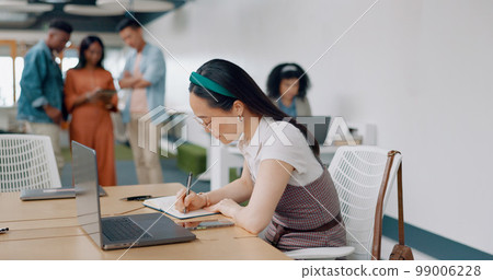 Asian woman, laptop and writing in notebook for planning strategy, schedule management or finance checklist in office. Employee, reading email communication and notes for creative startup company Asian woman, laptop and writing in notebook for planning strategy, schedule management or finance checklist in office. Employee, reading email communication and notes for creative startup company 99006228