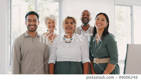 Collaboration, motivation and mindset with a business team posing for a photograph together in the office. Happy, smile and teamwork with a man and woman employee taking a picture while at work Collaboration, motivation and mindset with a business team posing for a photograph together in the office. Happy, smile and teamwork with a man and woman employee taking a picture while at work 99006248