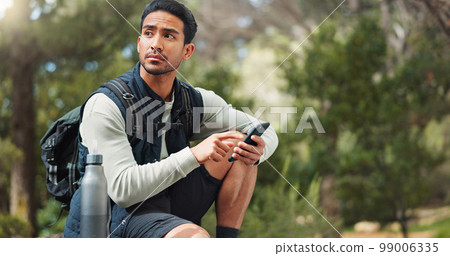 Nature hiking man, typing phone and sitting on rock for rest, break or relax with backpack outdoor. Forest adventure, woods explorer and smartphone for coordinate direction on gps navigation by trees 99006335