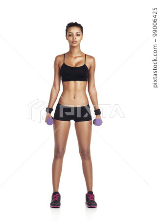 Studio, portrait and woman with dumbbell exercise for fitness goals, weight loss diet or bodybuilding for strong body. Wellness, arm workout and training athlete girl isolated on white background 99006425