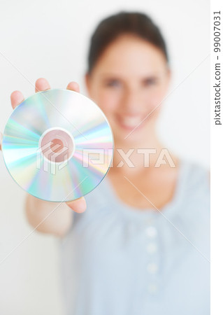 Vintage, music and hand of woman with cd in studio showing nostalgic, fun and old fashioned entertainment with mockup. Hands, dvd and girl presenting shiny disc, copy space and isolated mock up Vintage, music and hand of woman with cd in studio showing nostalgic, fun and old fashioned entertainment with mockup. Hands, dvd and girl presenting shiny disc, copy space and isolated mock up 99007031