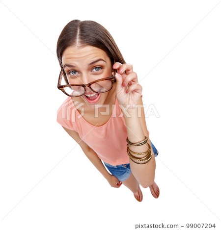 Woman, comedy and portrait of a model with glasses, smile and casual fashion being silly. White background, happiness and isolated young person looking up in a studio feeling positive, comic and fun Woman, comedy and portrait of a model with glasses, smile and casual fashion being silly. White background, happiness and isolated young person looking up in a studio feeling positive, comic and fun 99007204