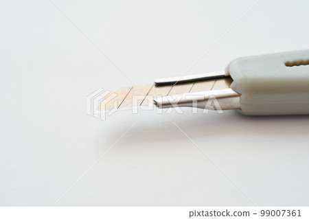 A utility knife placed on a white background A utility knife placed on a white background 99007361