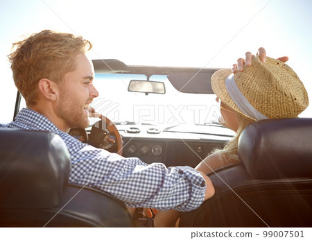 Car road trip, travel and back of couple on bonding holiday adventure, transportation journey or fun summer vacation. Love flare, convertible automobile and driver driving on Canada countryside tour 99007501