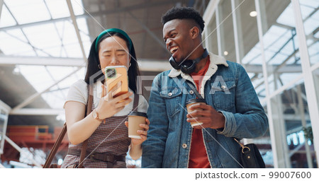 Shopping mall, smartphone and couple of friends on social media, website or blog for discount, sales and travel communication. Diversity gen z people walking, using phone or cellphone and coffee cup Shopping mall, smartphone and couple of friends on social media, website or blog for discount, sales and travel communication. Diversity gen z people walking, using phone or cellphone and coffee cup 99007600