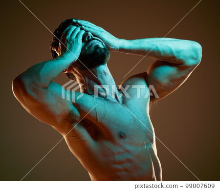 Nude, body and dramatic with a muscular man in studio on a dark background for art or self expression. Fitness, naked and hands covering face with a male model posing for health, wellness or artwork 99007609