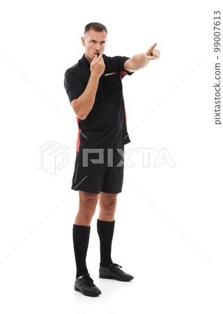 Sport, referee and man blowing whistle, pointing or gesture . in studio warning, sign or message on white background. Sports, coach and hand for rules, compliance and caution while training isolated 99007613