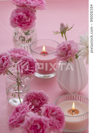 pink roses and candles 99008384
