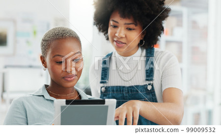 Tablet, teamwork and collaboration with a woman designer and her creative assistant talking about an idea in the office. Internet, technology and design with a female employee and a colleague at work 99009532