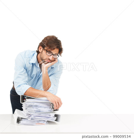 Stress, burnout and businessman with paper, documents and workload pressure on a white background. Overwhelmed, male and corporate employee with boring admin task looking exhausted, sad and isolated 99009534