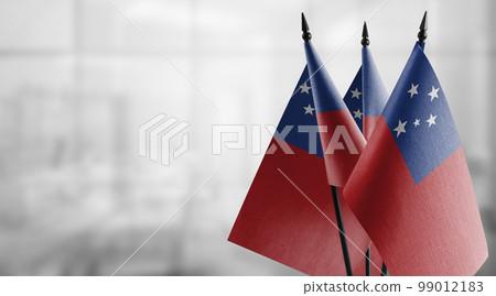 Small flags of the Samoa on an abstract blurry background 99012183