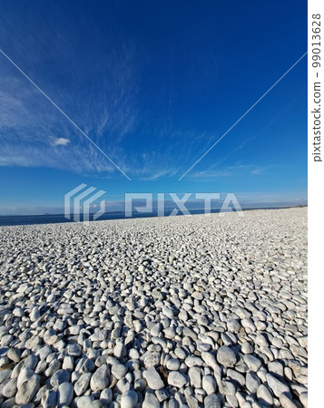 Blue sky and white rocks Kansai Airport in the distance 99013628