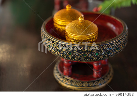 Bangkok Thailand Beautiful handmade tray and tea cup filled with green glass 99014398