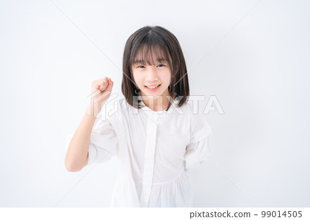Girl Elementary school student Guts pose Bird's eye view Girl Elementary school student Guts pose Bird's eye view 99014505