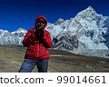 Hiker woman posing with mountains at background 99014661