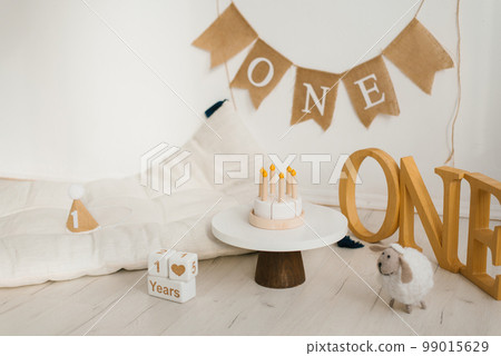 Wooden toy birthday cake. Photo zone of the celebration of the first year of the baby 99015629