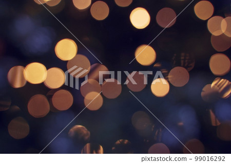Multicolored bright shiny bokeh, backdrop for the festive decoration of the New Year, Christmas, birthday, anniversary and other holiday or greeting card. Dark abstract background. Defocused image. Multicolored bright shiny bokeh, backdrop for the festive decoration of the New Year, Christmas, birthday, anniversary and other holiday or greeting card. Dark abstract background. Defocused image. 99016292