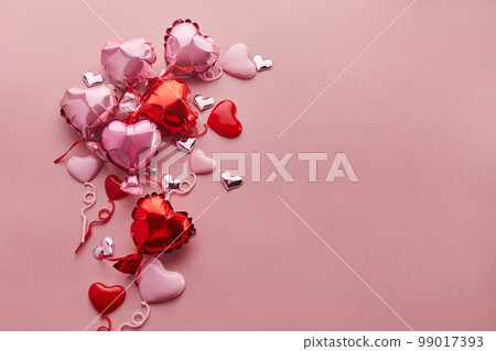 Air Balloons of heart shaped foil on pink background. Love concept. Valentine's Day. Air Balloons of heart shaped foil on pink background. Love concept. Valentine's Day. 99017393