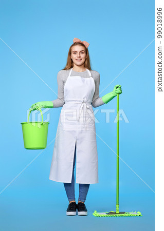 woman in rubber gloves and cleaner apron washing floor with mop 99018996