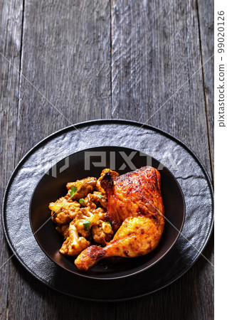 baked chicken leg with spicy roast cauliflower baked chicken leg with spicy roast cauliflower 99020126